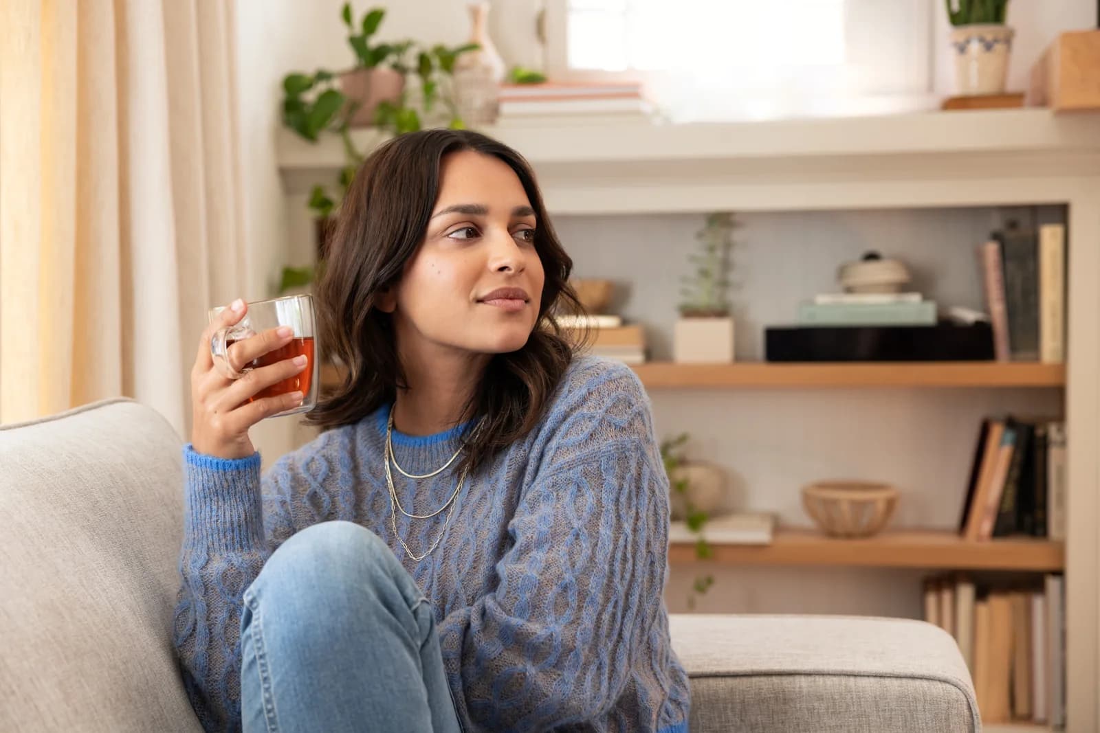 Woman drinking tea in an official Herbalife wellness image