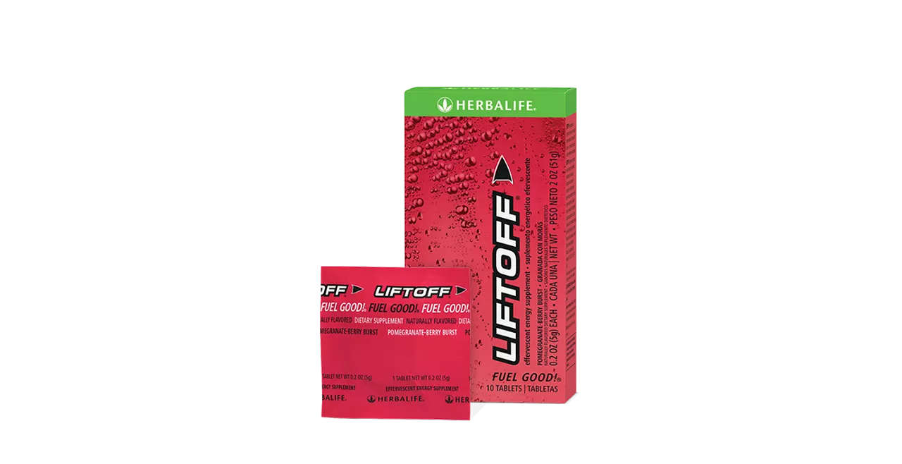Herbalife Liftoff Pomegranate-Berry Burst tablets dissolving in a glass of water